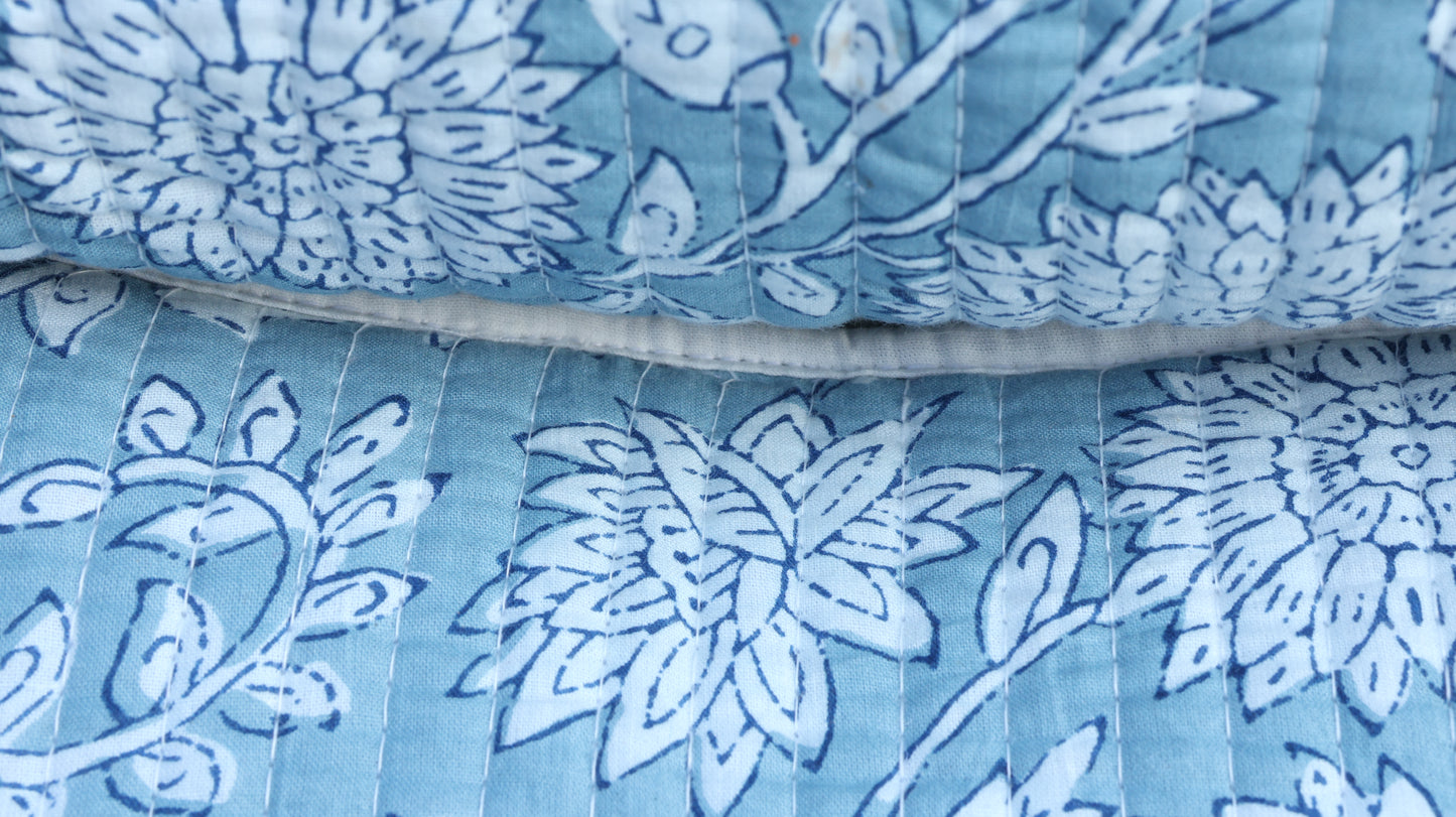 Travel-friendly cotton pouch with white floral motifs and wipeable lining