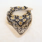 Patterned bandana with geometric design on a white background
