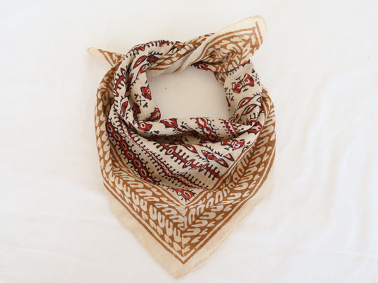 Hand block printed beige and red cotton bandana with tribal motifs, square shape.