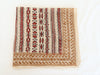 Hand block printed beige and red cotton bandana with tribal motifs, square shape.