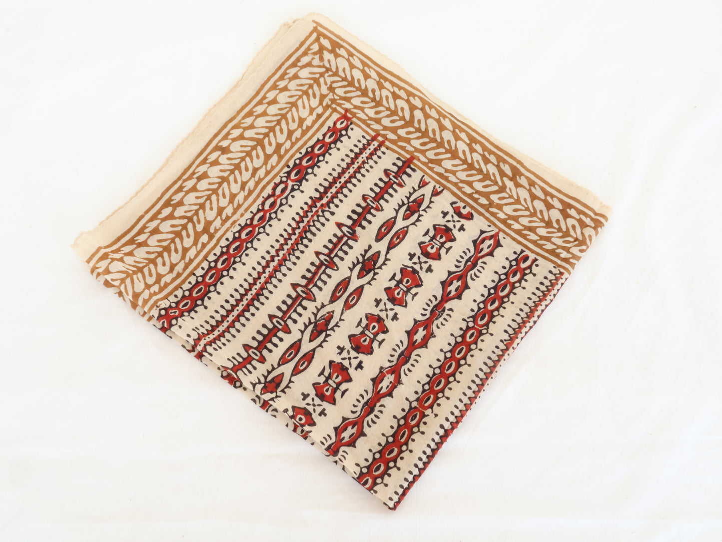 Hand block printed beige and red cotton bandana with tribal motifs, square shape.