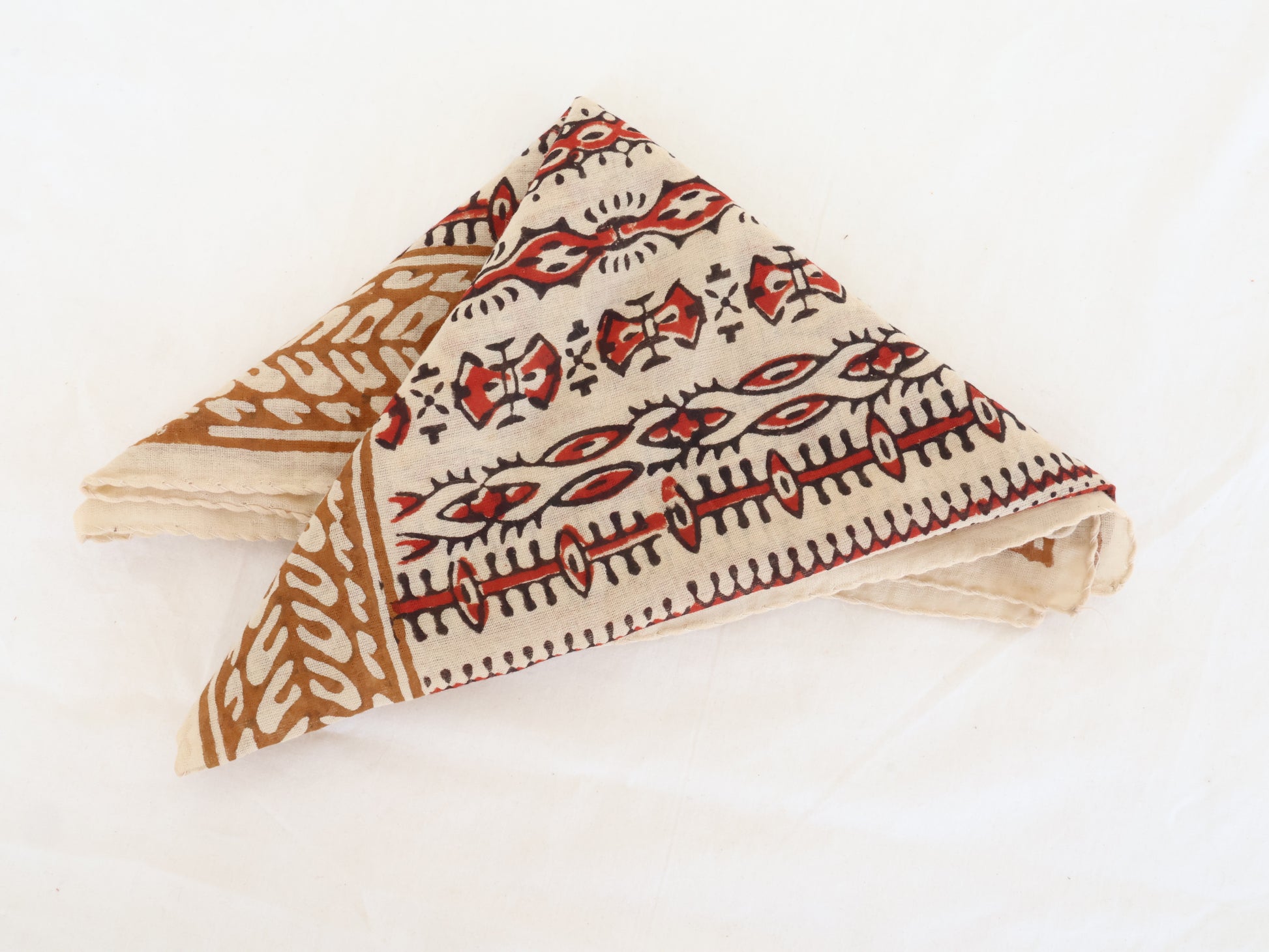 Hand block printed beige and red cotton bandana with tribal motifs,