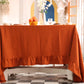 Orange tablecloth on a dining table cover