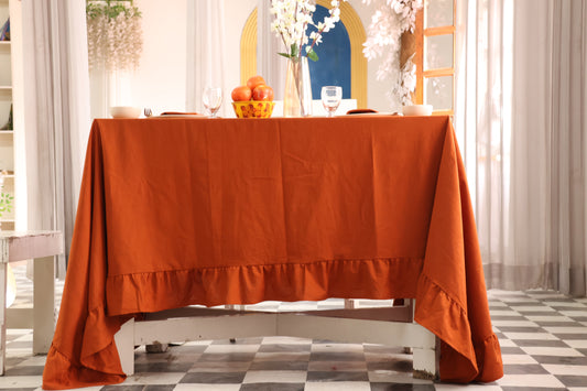 Orange tablecloth on a dining table cover