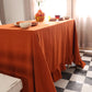 Orange tablecloth on a dining table cover