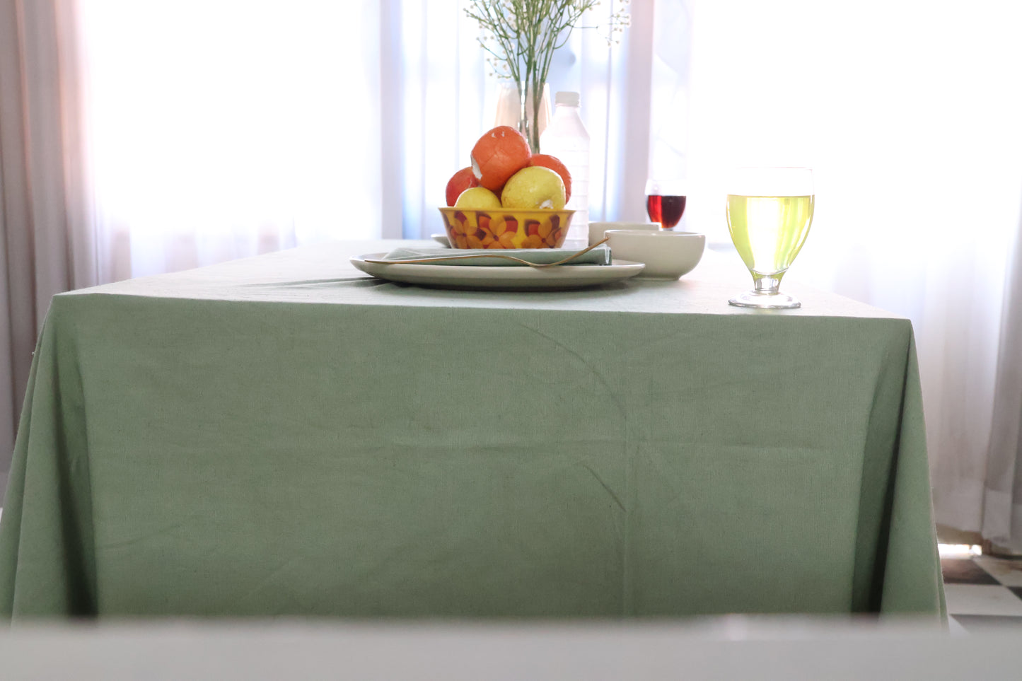 Table with a green tablecloth