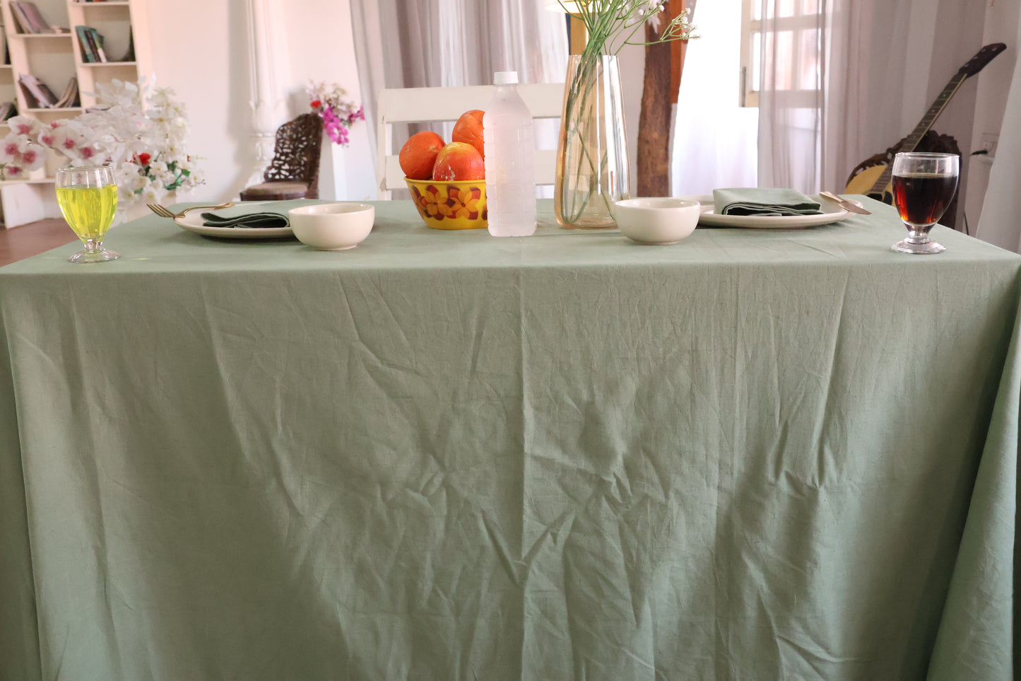 Dining table with a green tablecloth