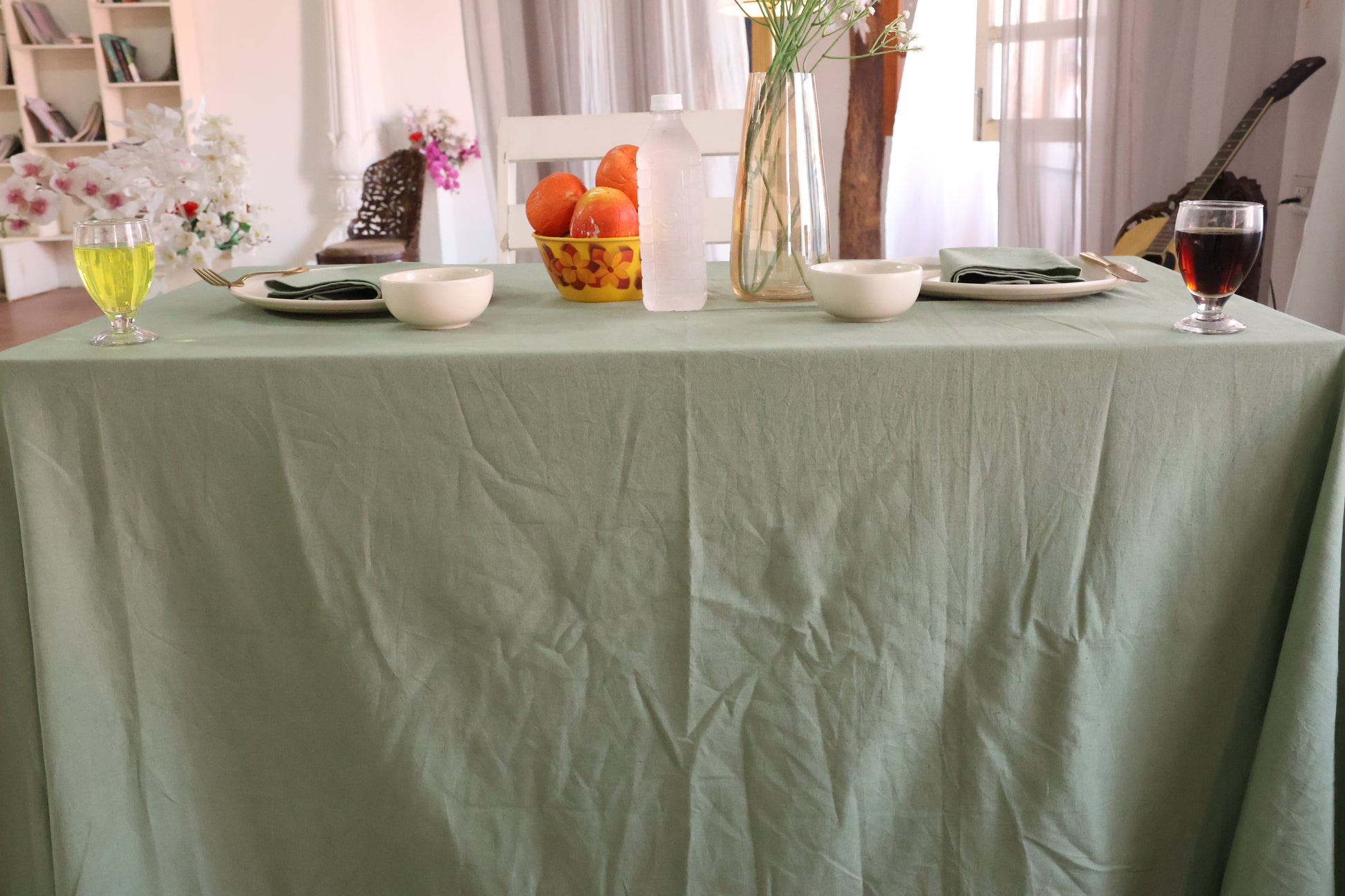 Dining table with a green tablecloth