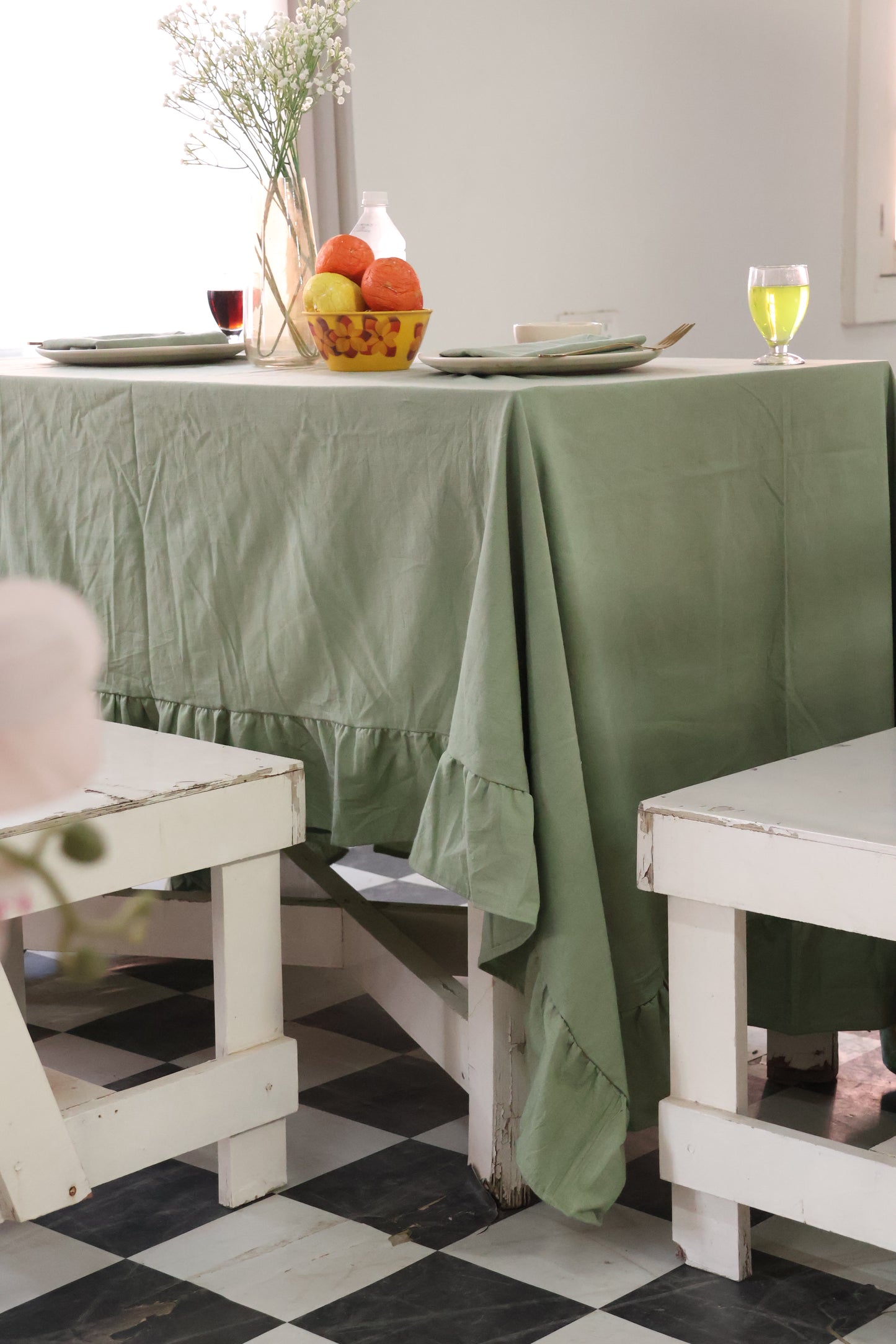 Green tablecloth on a white table
