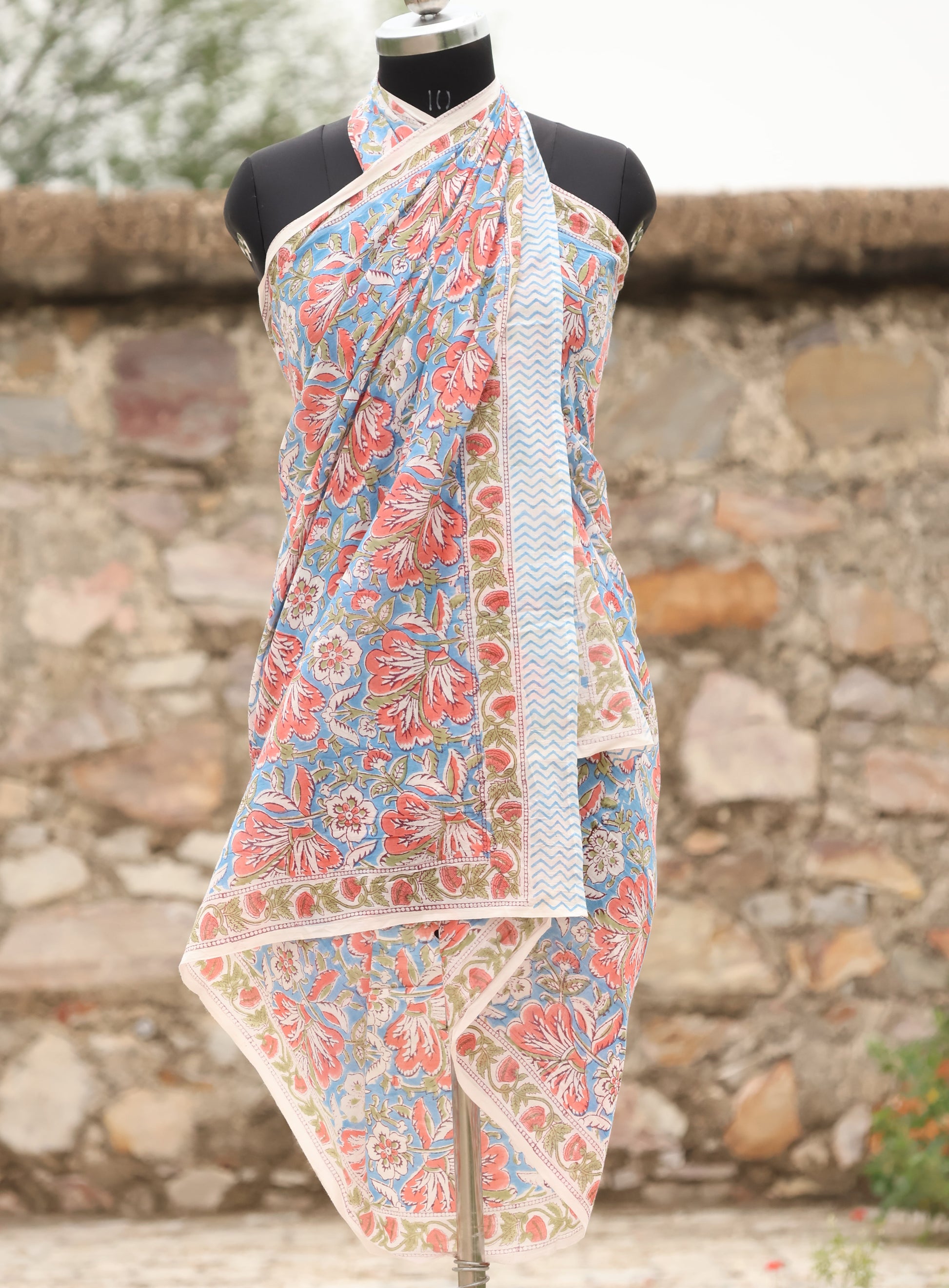 Handblock printed cotton sarong with coral floral design on blue
