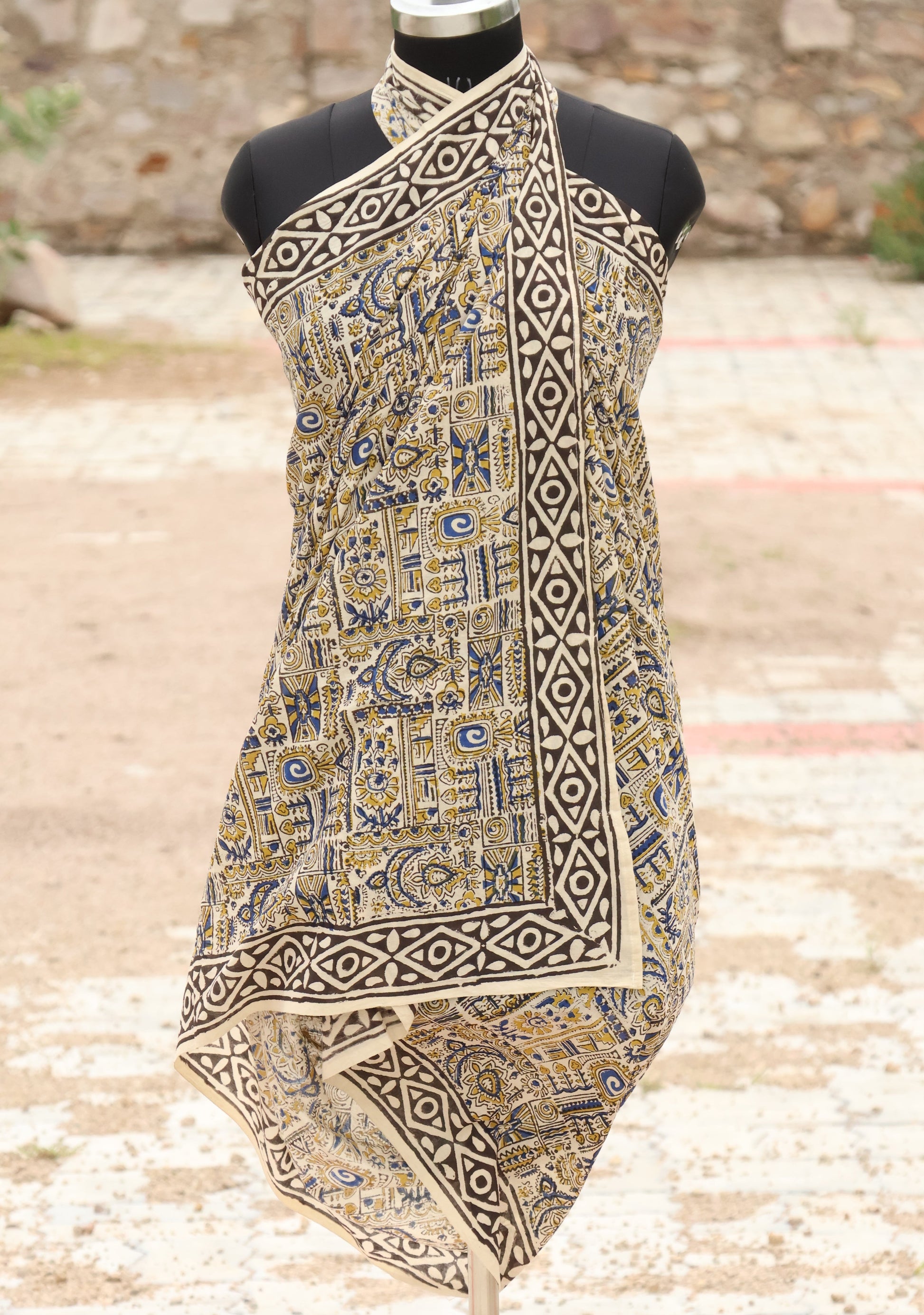 Handblock printed cotton sarong with tribal and geometric motifs in mustard, blue, and black