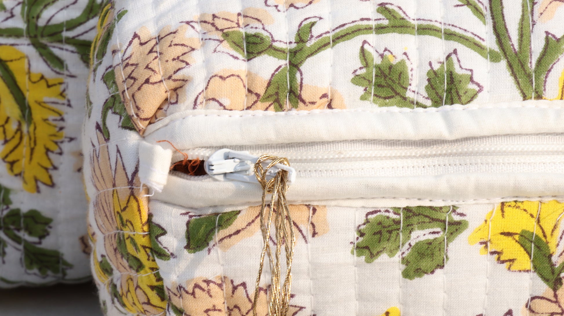 Floral-patterned bag with a zipper, close-up view