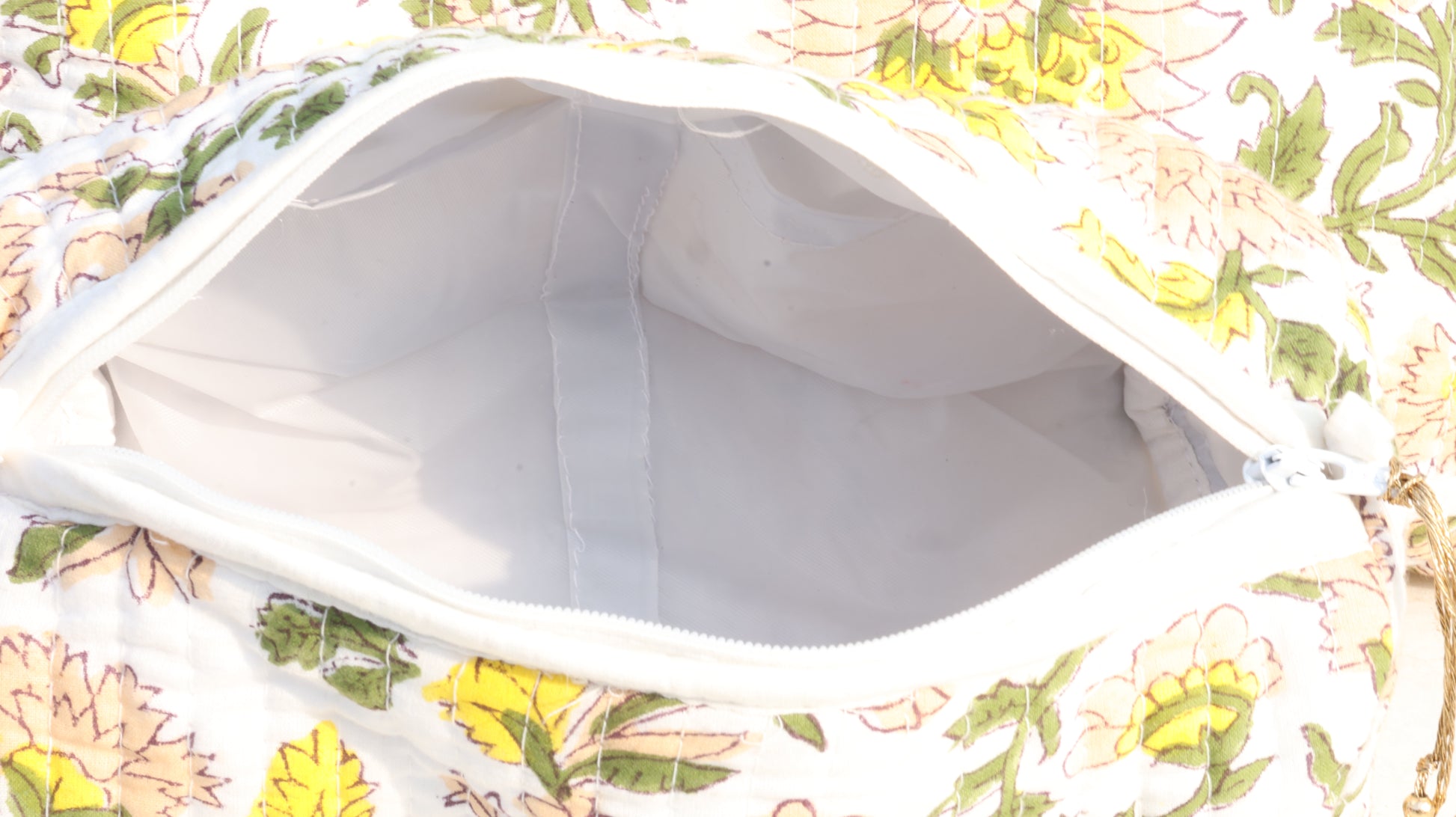 Floral-patterned pouch with a white interior