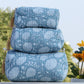 Hand block printed blue and white floral quilted travel bag stacked in three sizes