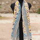 Handblock printed cotton sarong featuring yellow floral motifs, a blue decorative border