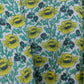 Floral fabric with yellow flowers on a green background
