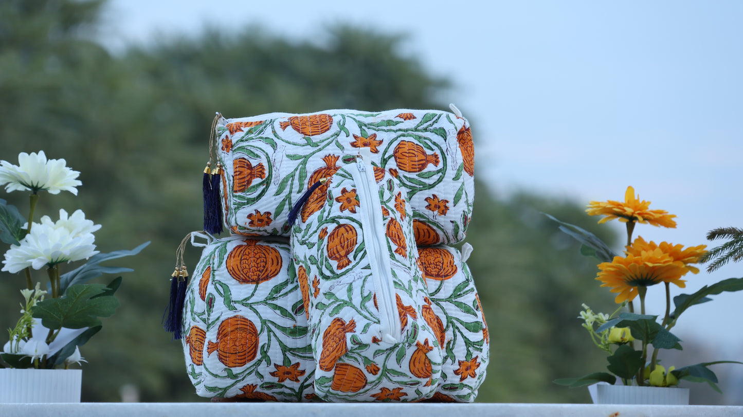 Decorative bag with orange floral pattern on a blurred natural background